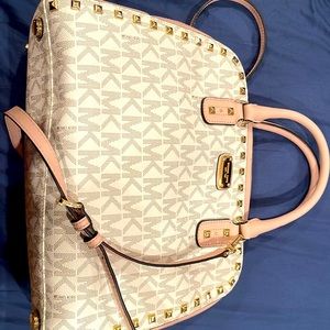 Pink and white Michael Kors purse.